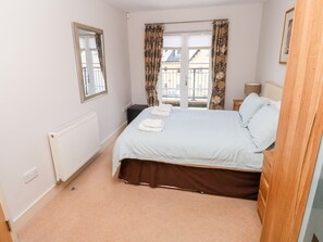 Enjoy a comfortable stay in this well-appointed room with a neatly made bed and radiator.