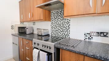 Cottage | Cucina privata | Microonde, piano cottura, bollitore elettrico, tostapane