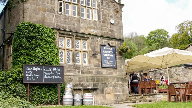 A stone building with a signboard advertising 'Jennings Haworth Old Hall Inn' and 'Fish Night' on Wednesdays. - Heather Corner (Keighley)