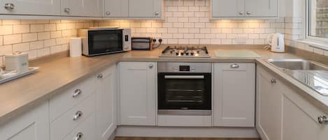 Cottage | Private kitchen | Microwave, stovetop, dishwasher, highchair