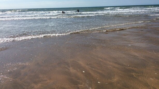 A beach with waves and a clear sky. - Driftwood (Bude)