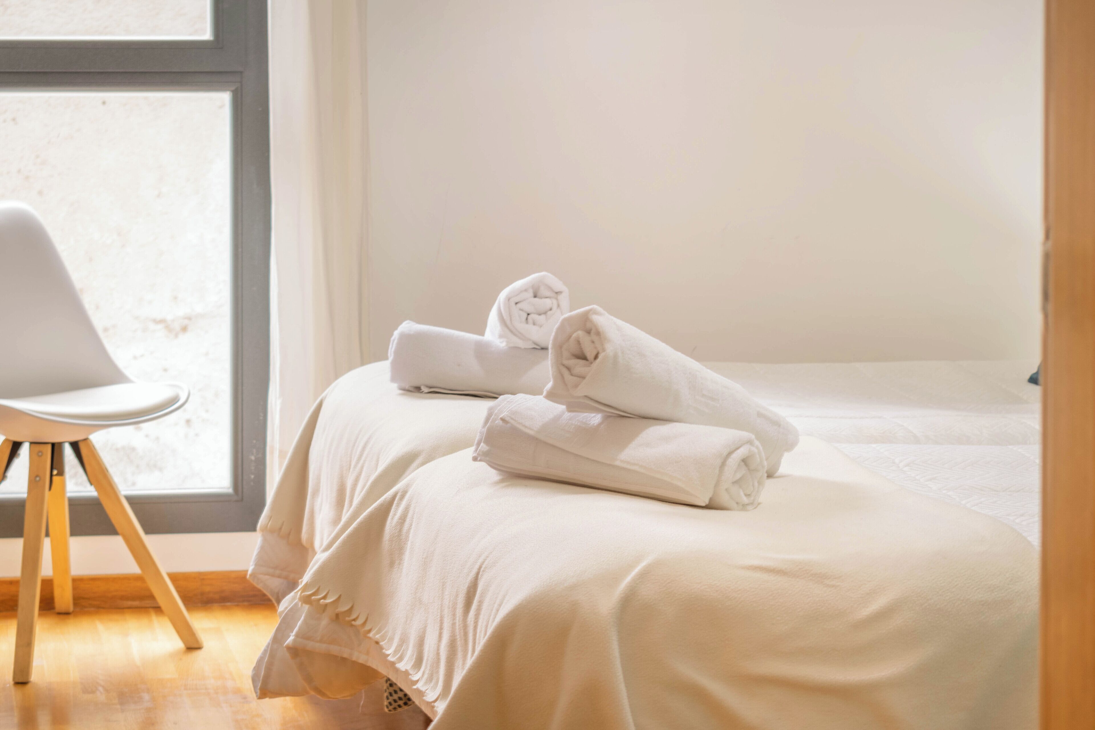 Premium bedding, blackout curtains, soundproofing, iron/ironing board