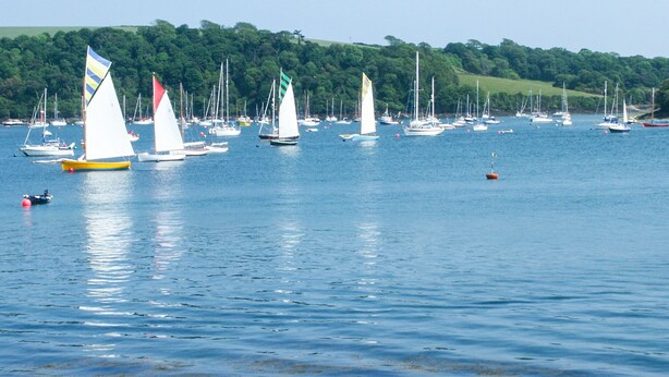 A marina with multiple sailboats and yachts. - Stones Throw (Truro)