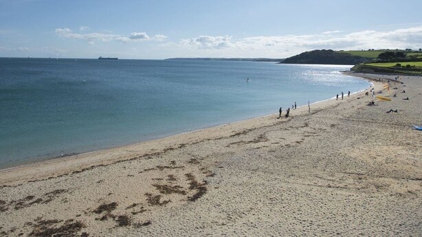 A beach with a clear sky, calm sea, and distant ships. - 1 Florence Place (Falmouth)
