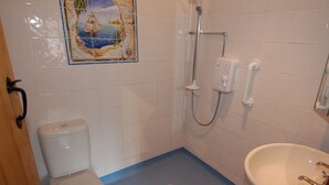 A bathroom with a toilet, a sink, and a shower. - The Milking Parlour (Wells)