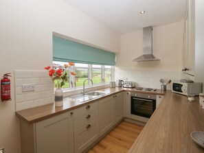 Cottage | Private kitchen | Fridge, highchair, cookware/dishes/utensils