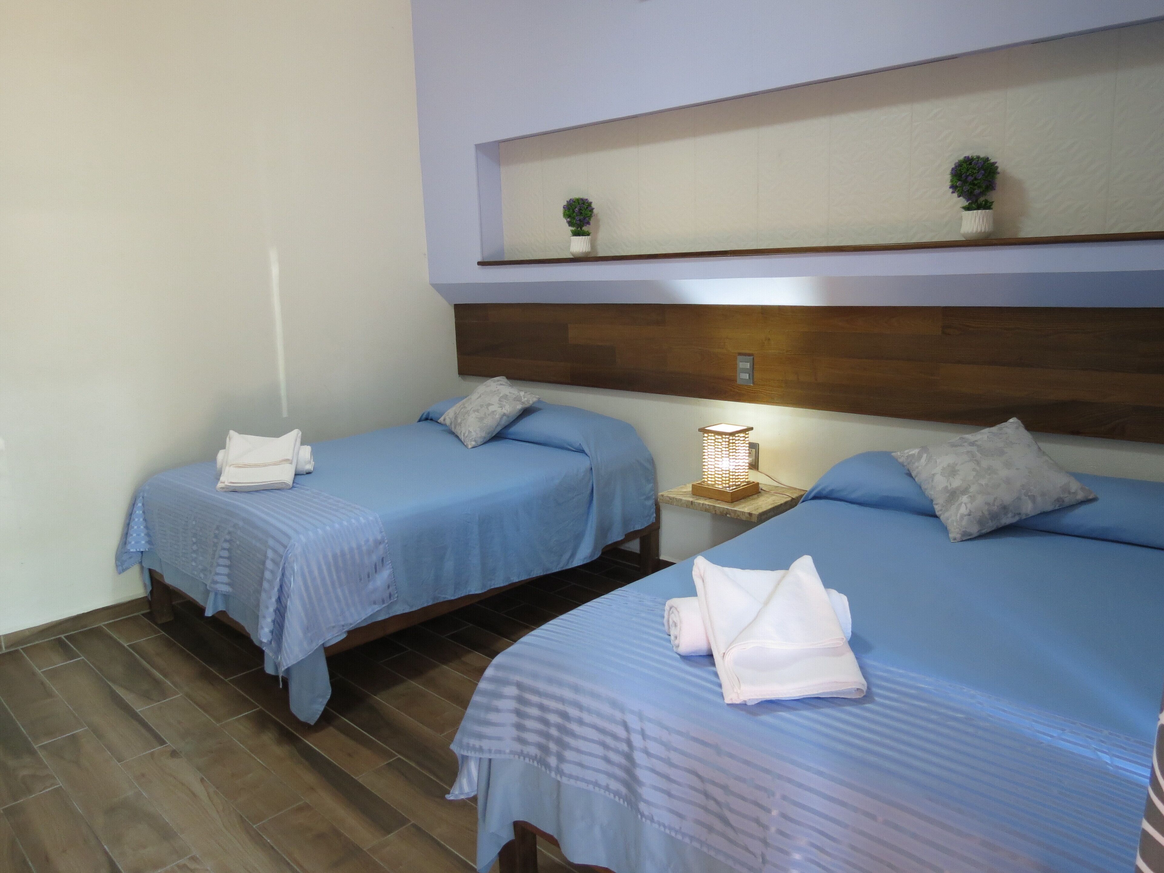 Junior Quadruple Room | Desk, bed sheets