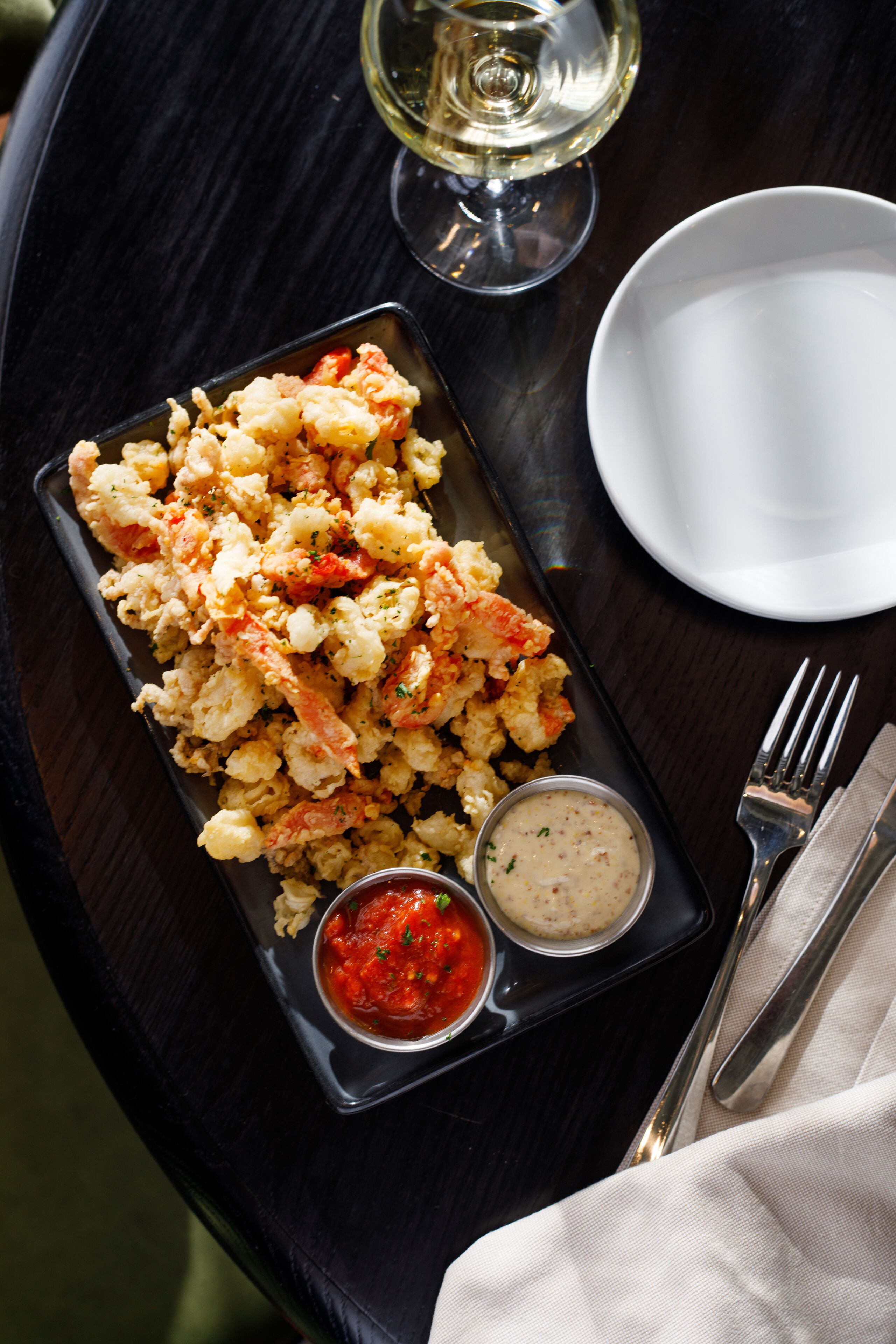 A tray with food and drinks on a table.