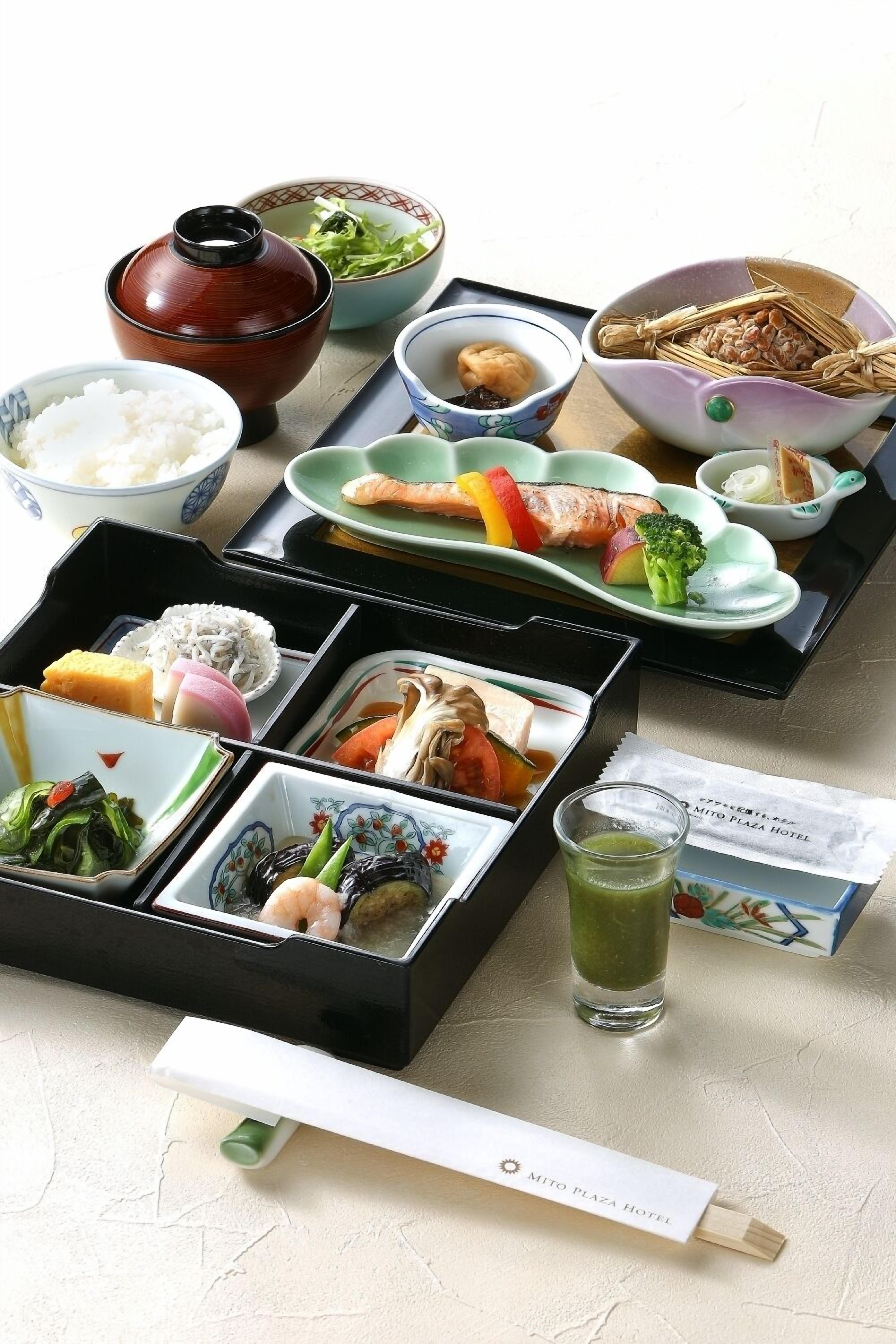 A traditional Japanese meal setup with various dishes and a tea set.