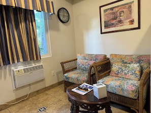 Suite (King, 2 Queen Spa Suite, Full Kitchen) | Living area | 42-inch LCD TV with cable channels, TV, fireplace