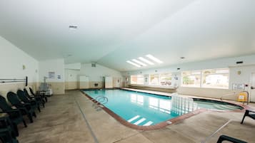 Relax by the pool with lounge chairs and diving boards.