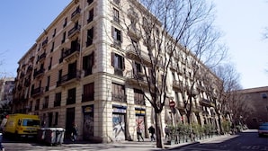 A multi-story building with a classical architectural style, featuring balconies and large windows. - Spectacular Apartment!, Right To The Ramblas, The Heart Of The Histori (Barcelona)
