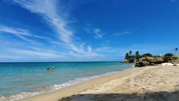 On the beach, sun loungers, beach towels