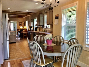 Enjoy meals in the kitchen's central island and dining area with ample counter space and comfortable seating.