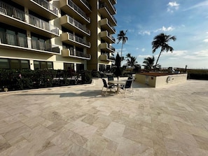 Outdoor dining - Beachfront 1BR condo with pool, WiFi, and heated outdoor pool. (Marco Island)