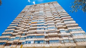 A high-rise building with multiple balconies and large windows. - Coblanca 8-92 (Benidorm)