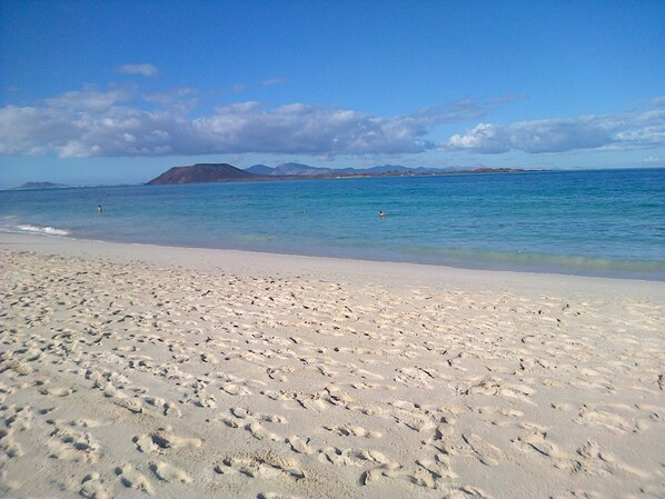 On the beach, sun-loungers, beach towels