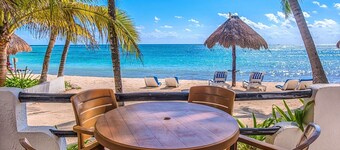 Walk onto the beach from your patio door! AC, WiFi, great for families!