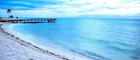 On the beach, sun loungers, beach towels