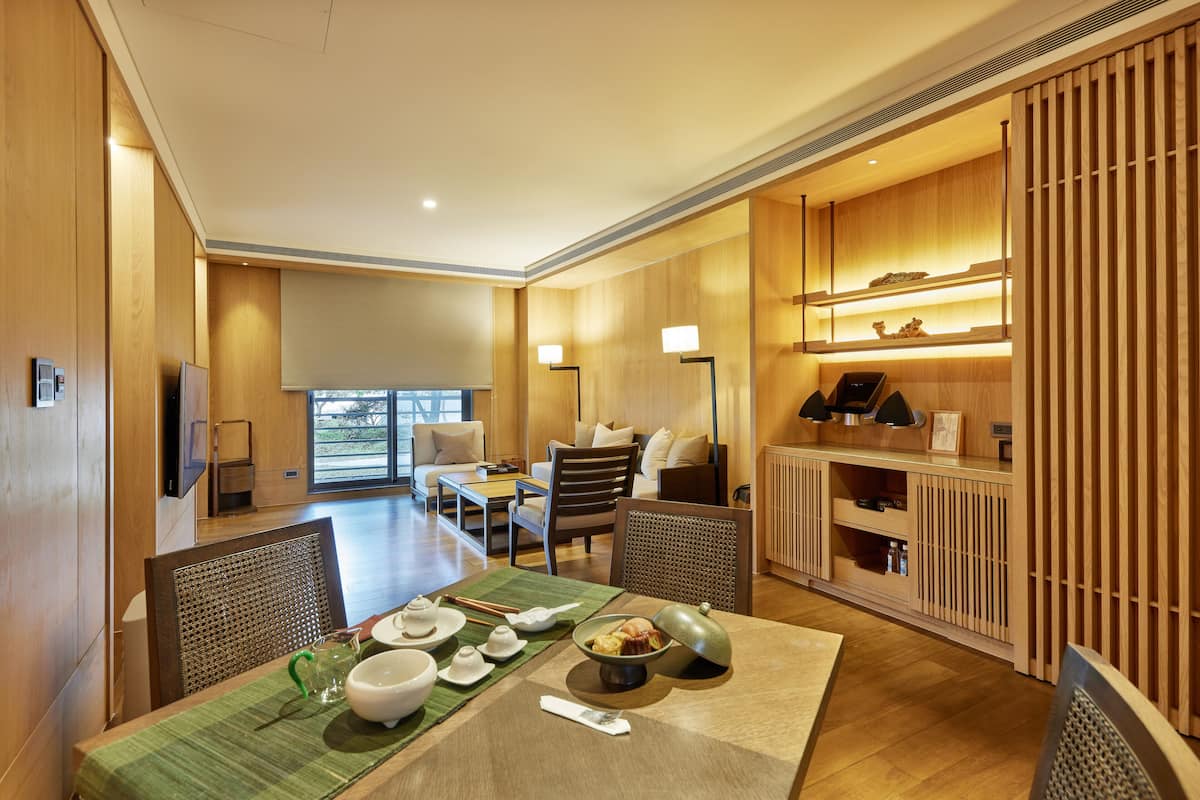 Exclusive Double Room, Balcony | Living area | 58-inch LCD TV with cable channels, TV, books