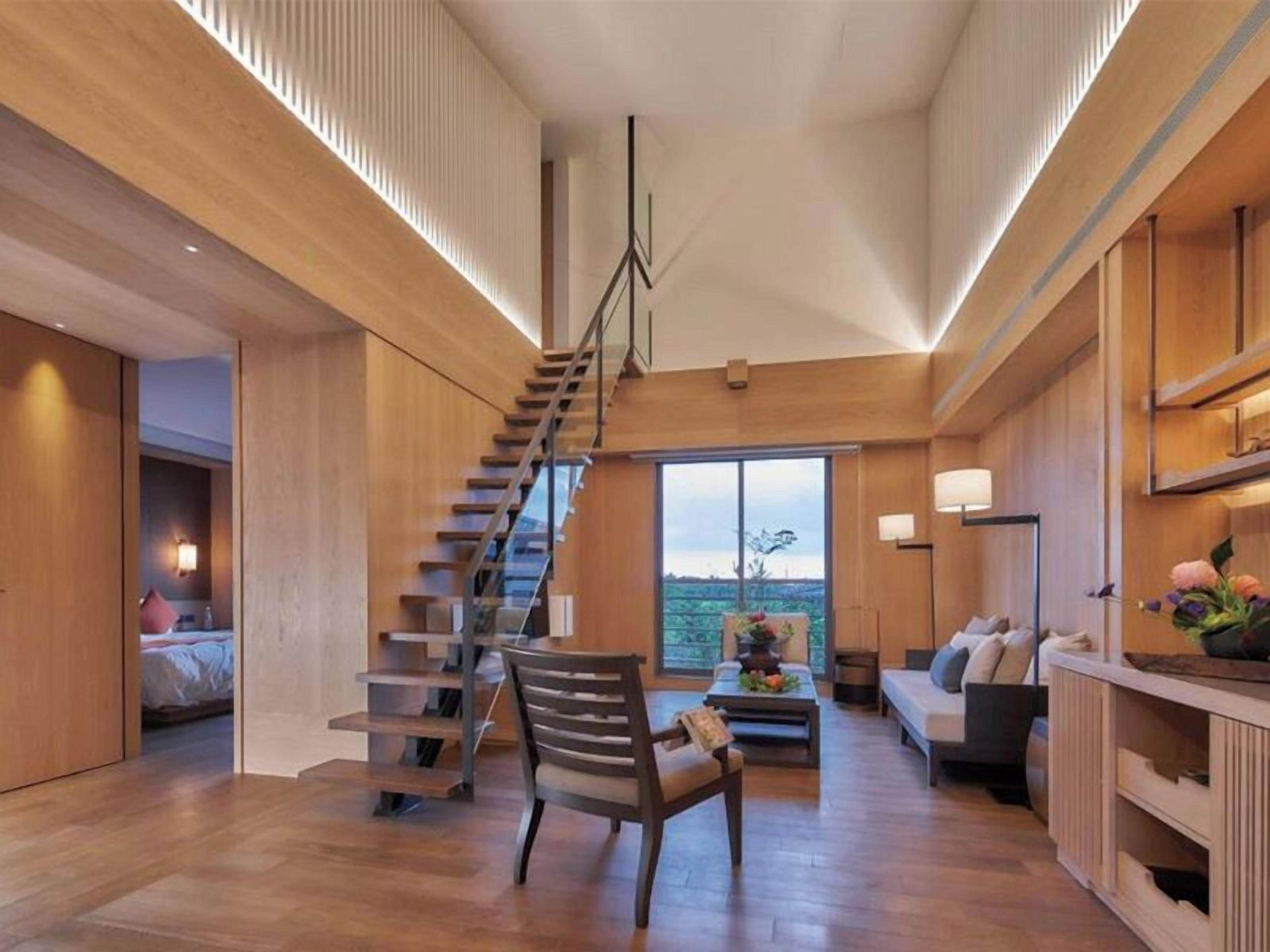 Family Quadruple Room, Balcony | Living area | 58-inch LCD TV with cable channels, TV, books