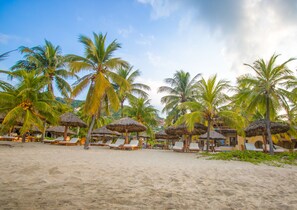 On the beach, sun-loungers