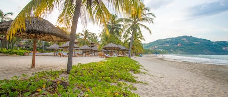On the beach, sun loungers