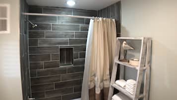 Combined shower/tub, hair dryer, towels, soap