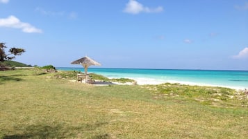 On the beach, sun-loungers, beach towels
