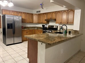 Fridge, microwave, oven, stovetop - Home with Pool Table in Phoenix near Scottsdale (Phoenix)