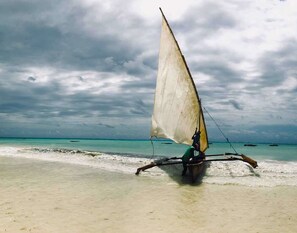 On the beach, white sand, sun-loungers