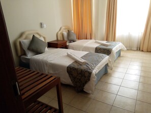 Blackout drapes, iron/ironing board, bed sheets