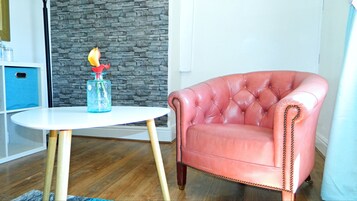 Large Double Room | Living area | Flat-screen TV