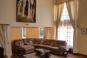 Executive Suite | Living room | 32-inch flat-screen TV with cable channels, TV - Adies Garden Suites (Nairobi)