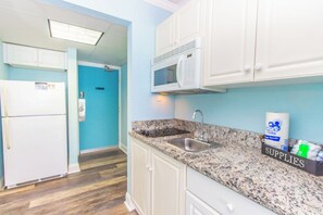 Fridge, microwave, stovetop, coffee/tea maker