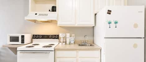 Coffee/tea maker, fridge, microwave, oven
