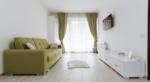 高级公寓, 1 张双人床和 1 张沙发床, 无烟房, 阳台 | 客厅 | 50-厘米纯平电视（配备有线频道）、电视、DVD 播放器