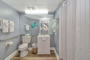 Shower, hair dryer, towels, shampoo