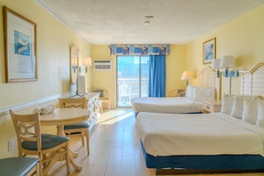 Relax in this classic room with two single beds, a desk, and a dining area, plus a balcony.