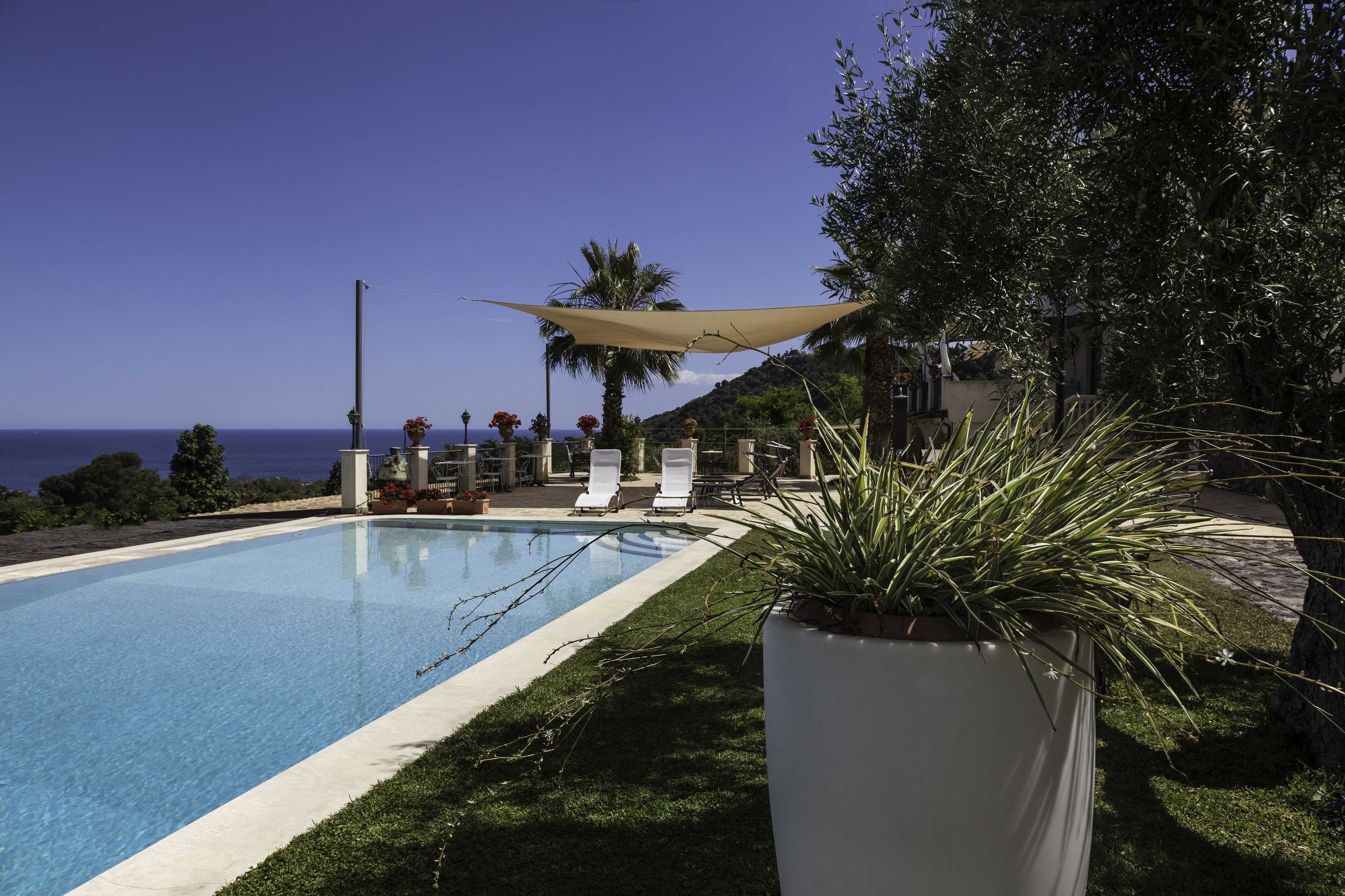 Seasonal outdoor pool, open 8:00 AM to 8:00 PM, pool loungers