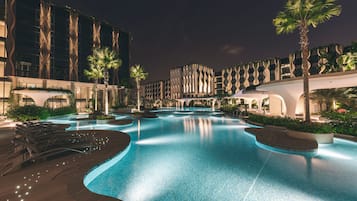 Relax by the inviting pool surrounded by lush landscaping and contemporary architecture.
