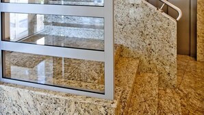 A modern interior with a glass partition, a staircase with granite steps, and an elevator. - Willa Tamara BlueApart Jurata (Jurata)