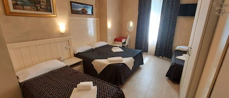 Economy Quadruple Room | In-room safe, iron/ironing board, free WiFi, bed sheets