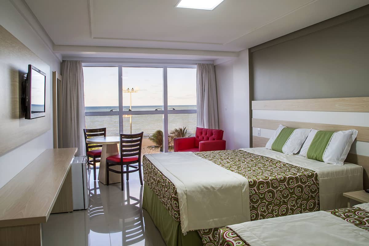 superior triple room, ocean view | 1 bedroom, minibar, in-room safe, desk