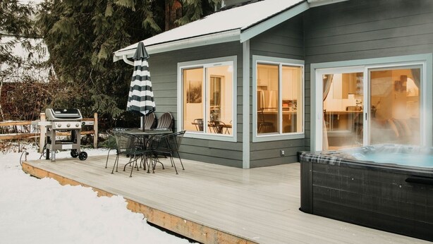 A house with a deck, a hot tub, and a grill area. - 62sl - Hot Tub - Wifi - Fireplace - Pets Ok 3 Bedroom Home by RedAwning (Deming)
