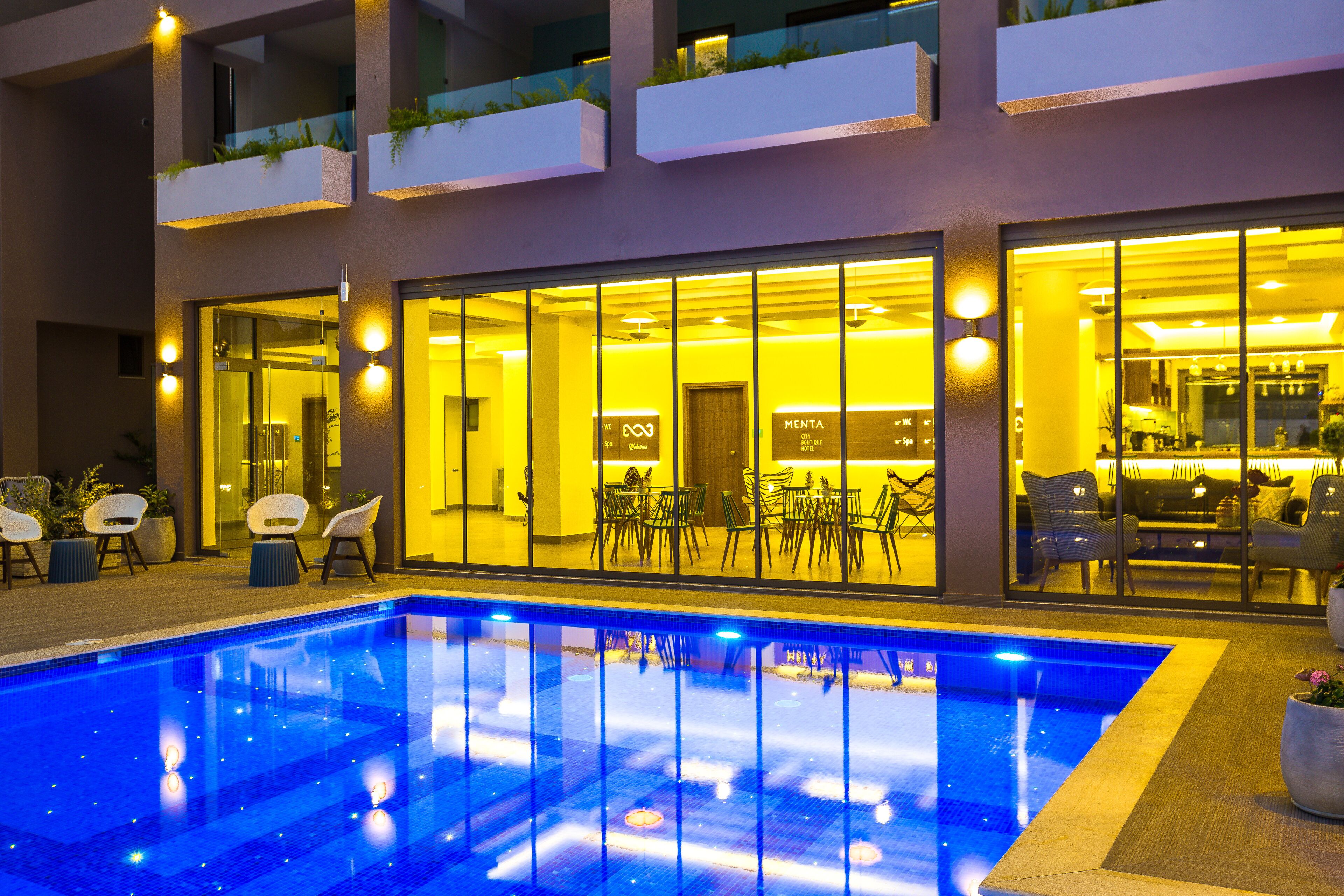 seasonal outdoor pool, open 8:00 am to 8:00 pm, pool umbrellas