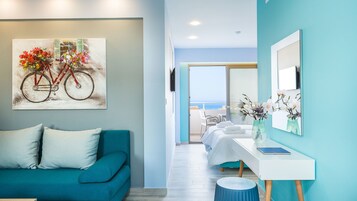 Junior Suite, Balcony | Living area | 26-inch flat-screen TV with cable channels, TV, books