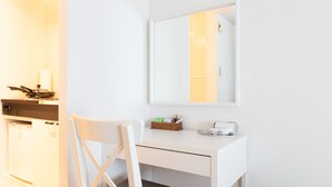 A clean, white room with a desk, chair, and a mirror. - KIKU'S ROOM (Osaka)