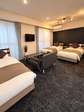 A hotel room with two beds, a sofa, a flat-screen TV, and a small table. - KIKU'S ROOM (Osaka)