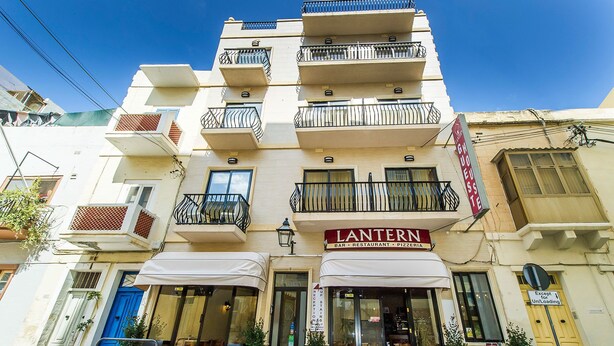 A multi-story building with a restaurant named "Lantern" on the ground floor. - Lantern Guest House (Zebbug)